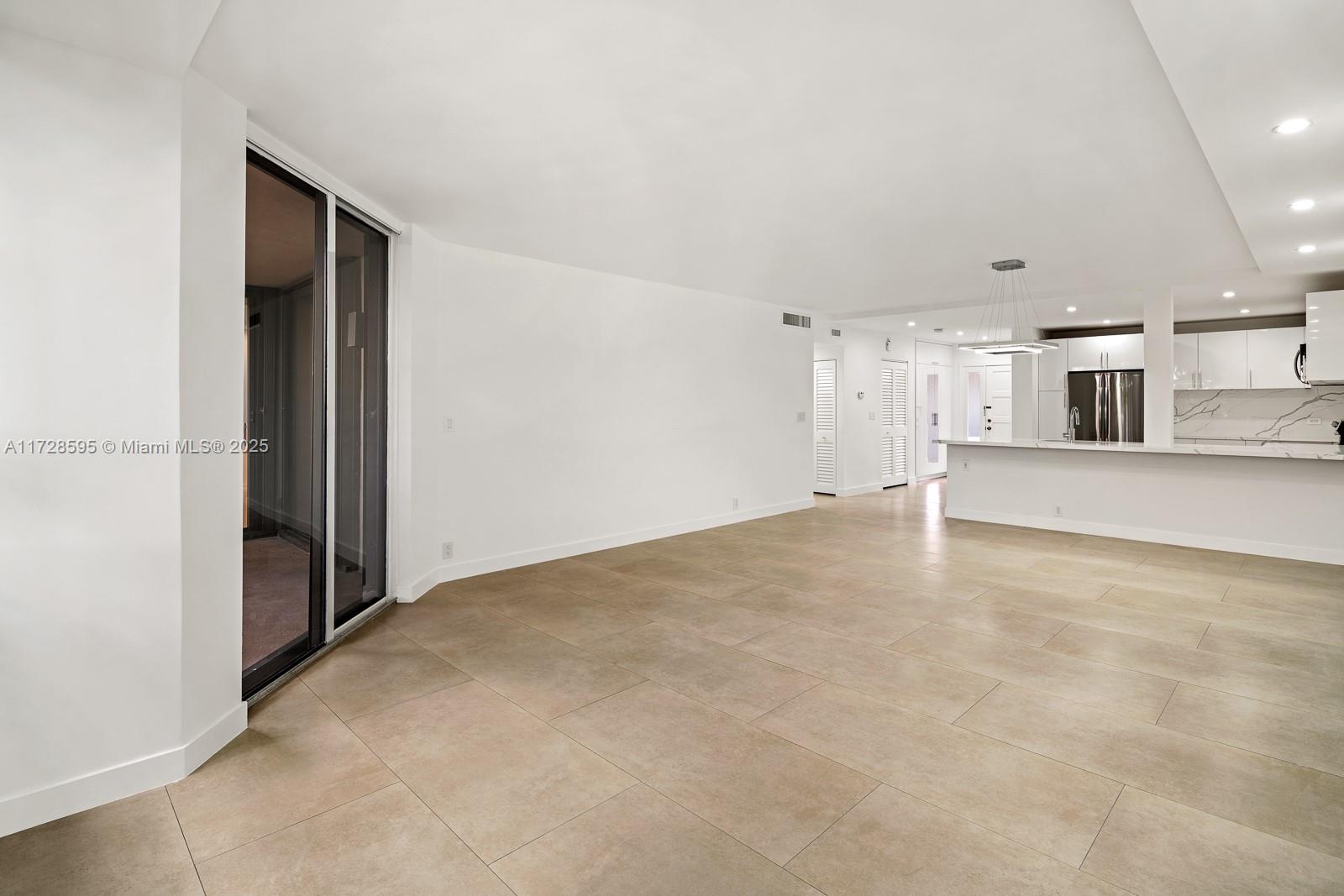 141 Crandon Boulevard, Unit 229 Key Biscayne, FL 33149 - Photo 7 of 30 a view of a kitchen with a sink