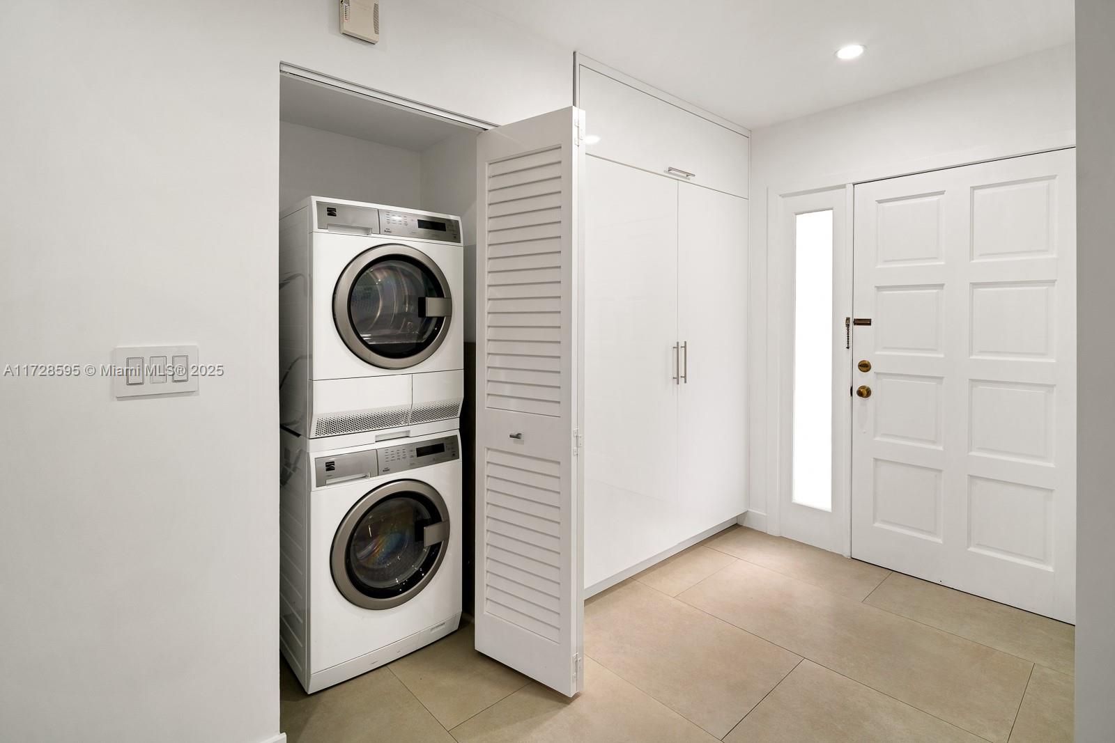 141 Crandon Boulevard, Unit 229 Key Biscayne, FL 33149 - Photo 8 of 30 a view of a storage & utility room with washer and dryer