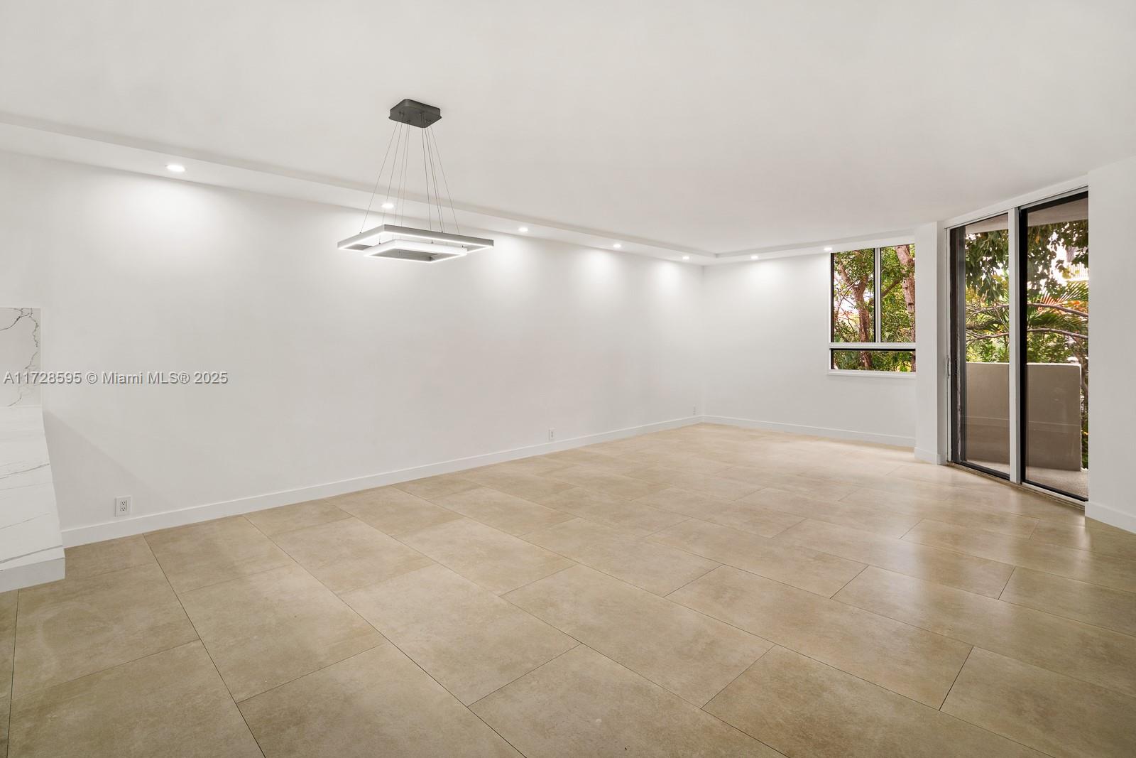 141 Crandon Boulevard, Unit 229 Key Biscayne, FL 33149 - Photo 9 of 30 wooden floor in an empty room with a window