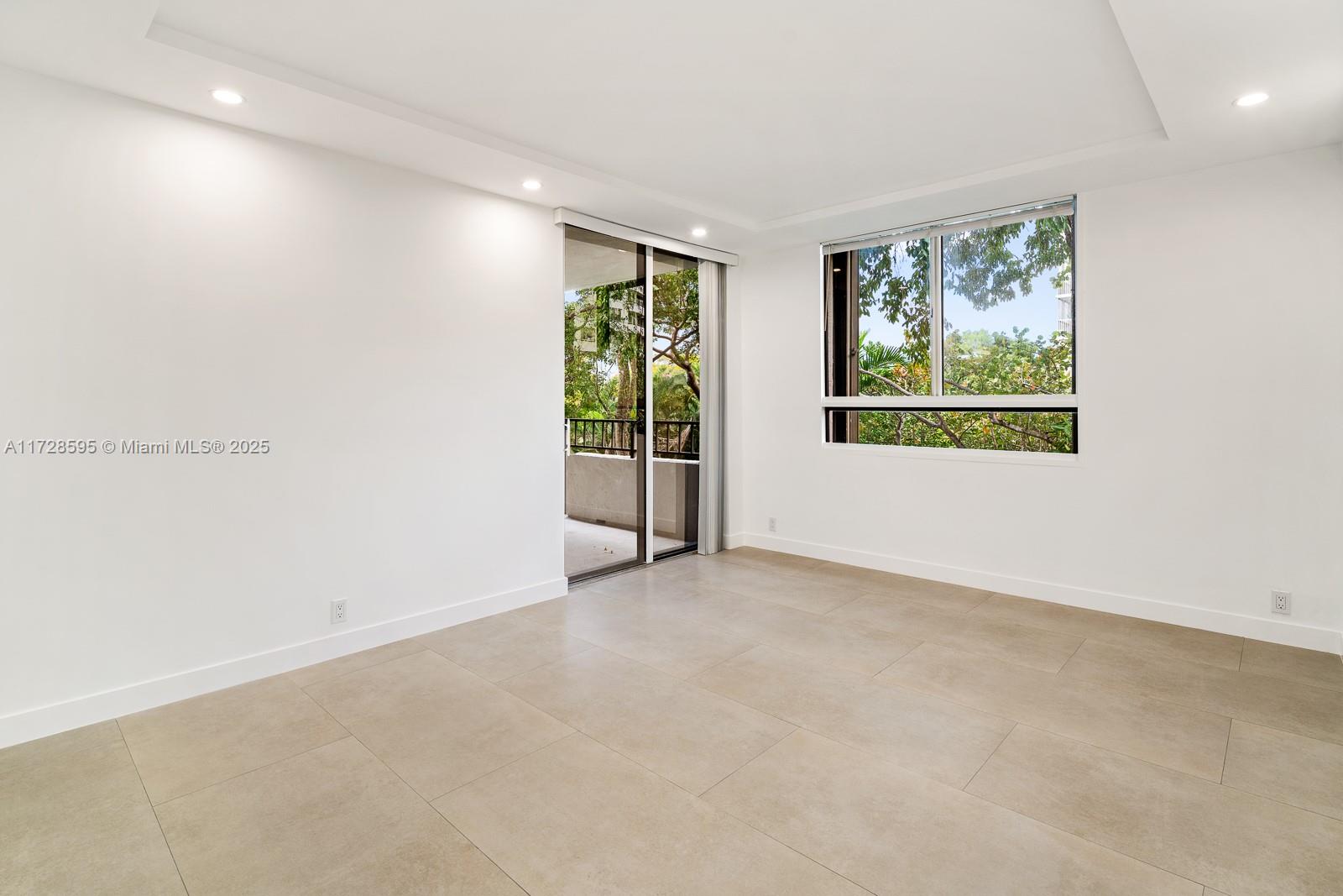 141 Crandon Boulevard, Unit 229 Key Biscayne, FL 33149 - Photo 10 of 30 an empty room with windows
