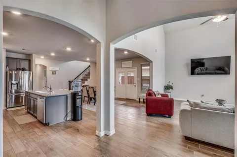 a living room with fireplace furniture and a flat screen tv