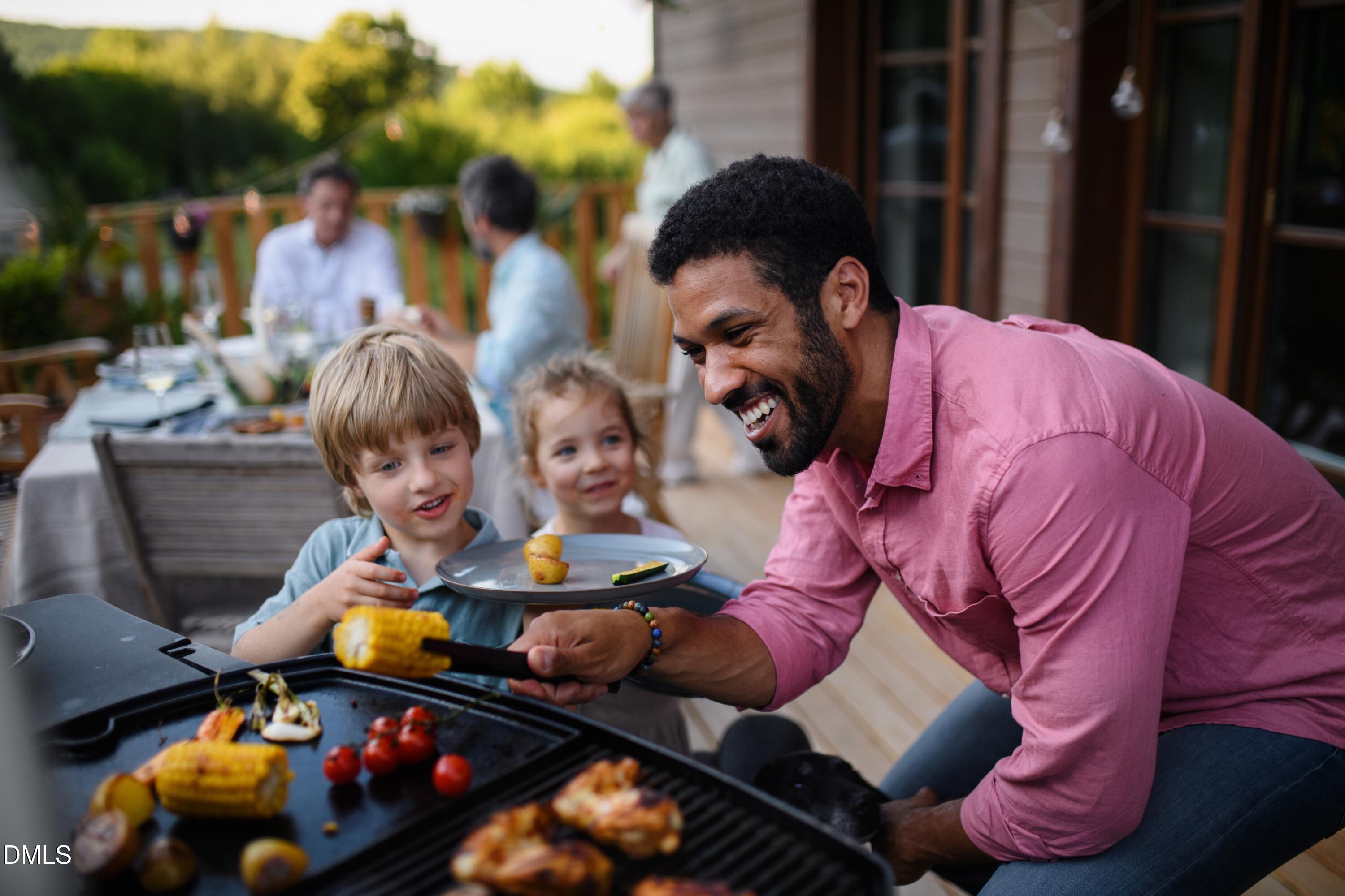 600 Hedrick Ridge Road, Unit 308 Cary, NC 27519 - Photo 32 of 32 Lifestyle_2Kids+Dad_BBQ