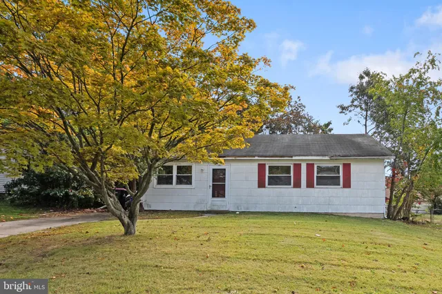 a house view with swimming pool in front of it