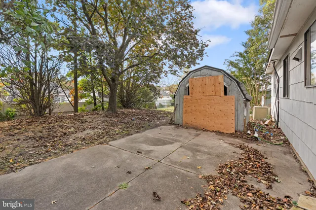 a backyard of a house with a yard and garage