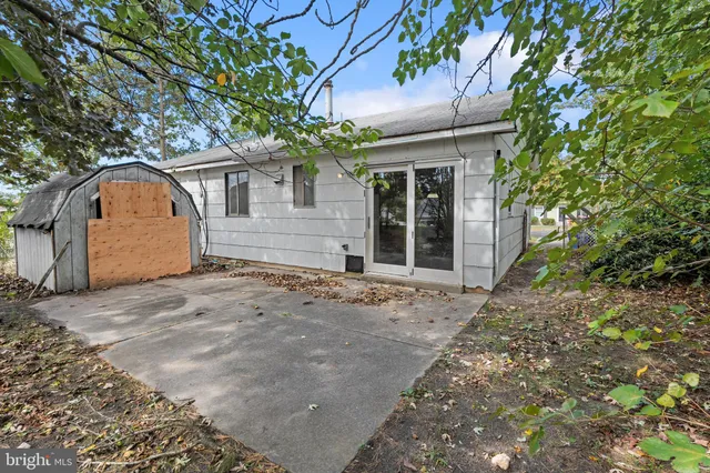 a view of a house with a tree