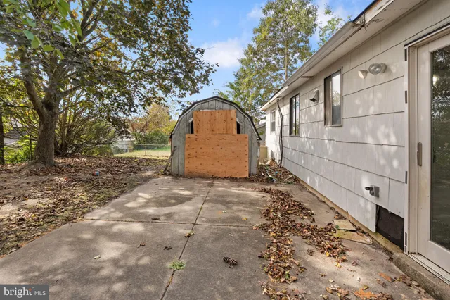 a backyard of a house with a shaded area