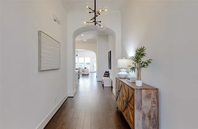 a spacious bathroom with a double vanity sink a mirror and a shower