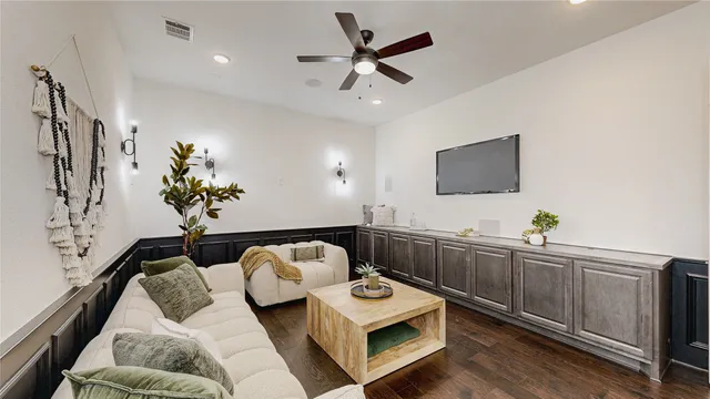 a open dining room with stainless steel appliances kitchen island granite countertop furniture and wooden floor