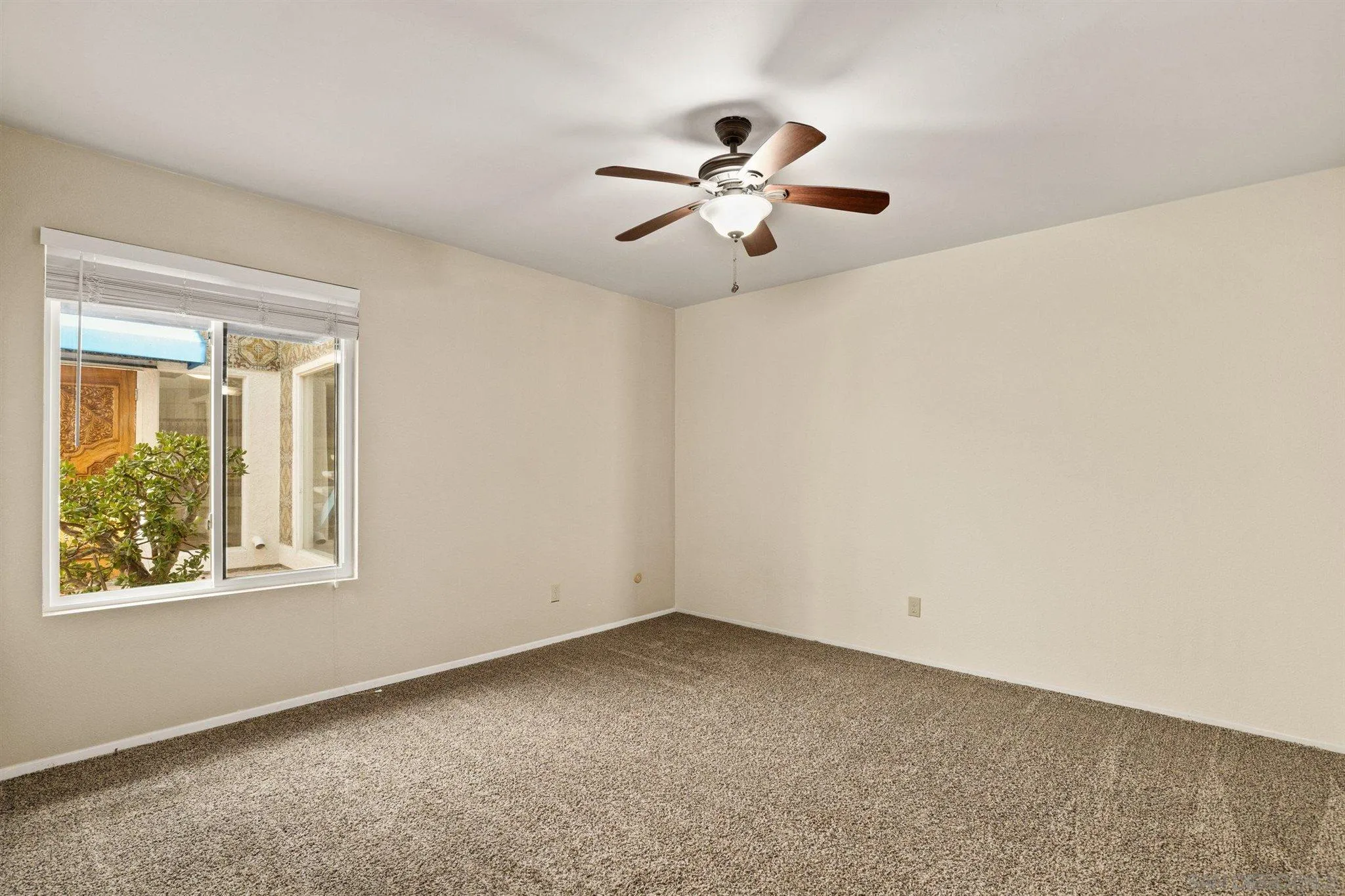 8308 Regents Road, Unit 1H San Diego, CA 92122 - Photo 12 of 14 a view of an empty room with a window