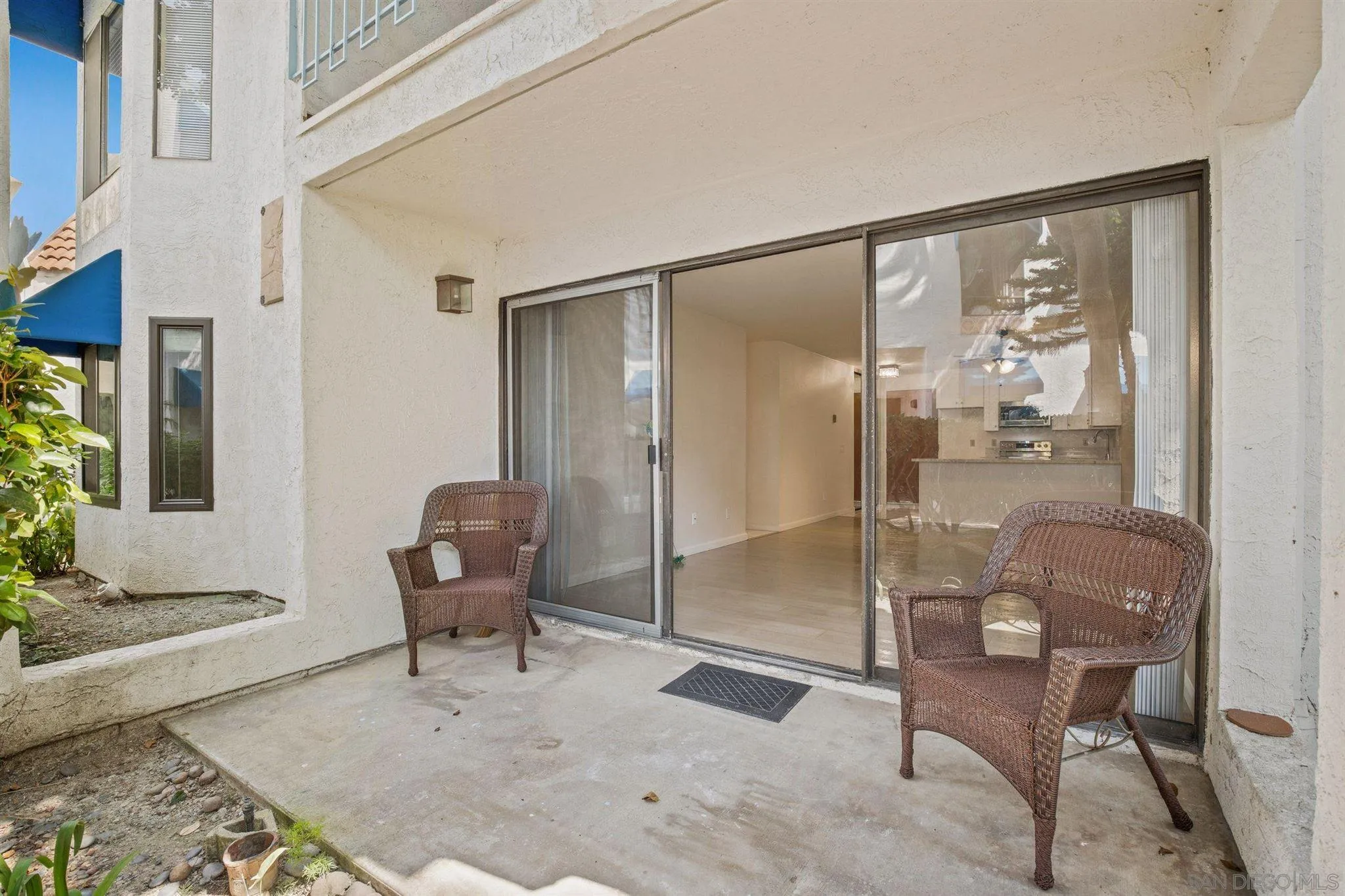 8308 Regents Road, Unit 1H San Diego, CA 92122 - Photo 4 of 14 a living room with furniture and a floor to ceiling window