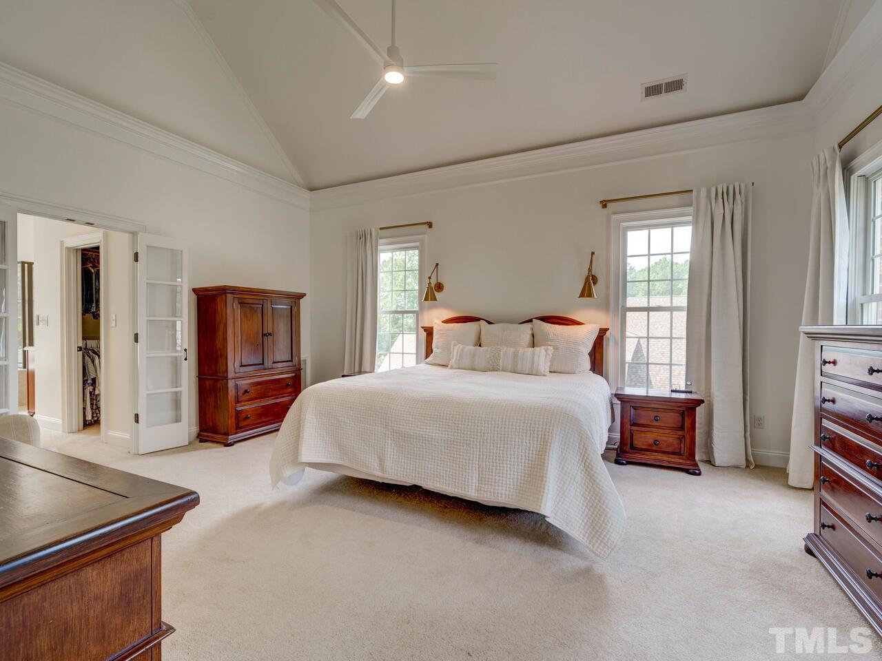 3213 Mossy Ridge Court Raleigh, NC 27613 - Photo 22 of 30 a bedroom with a bed and a dresser