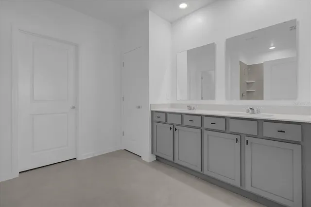 a bathroom with a sink and mirror