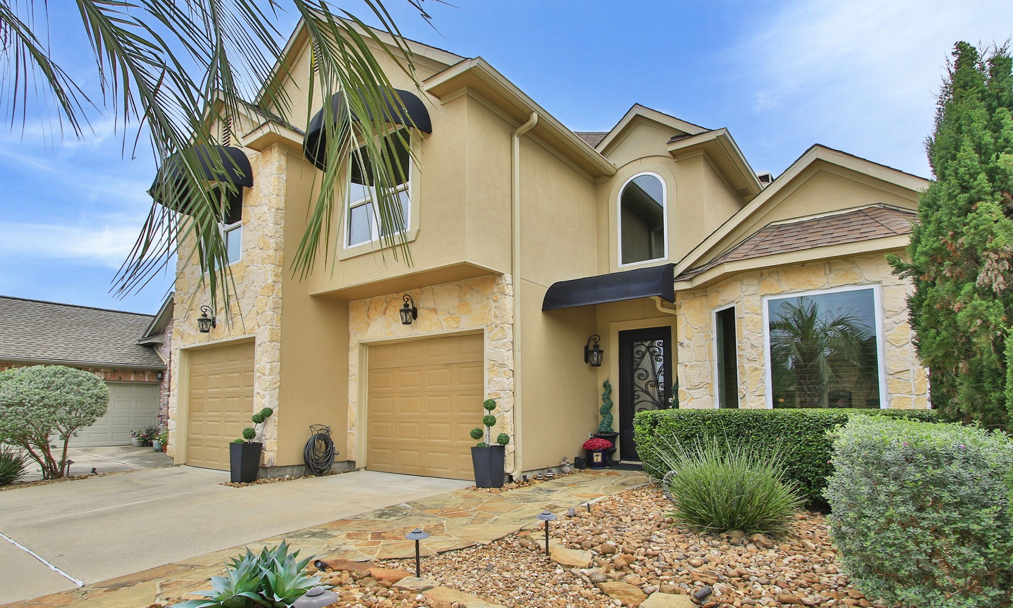 16610 Manningtree Lane Spring, TX 77379 - Photo 4 of 50 This custom built home has unique stone landscaping offering easy maintenance, plus sprinkler system and fiber optic internet.