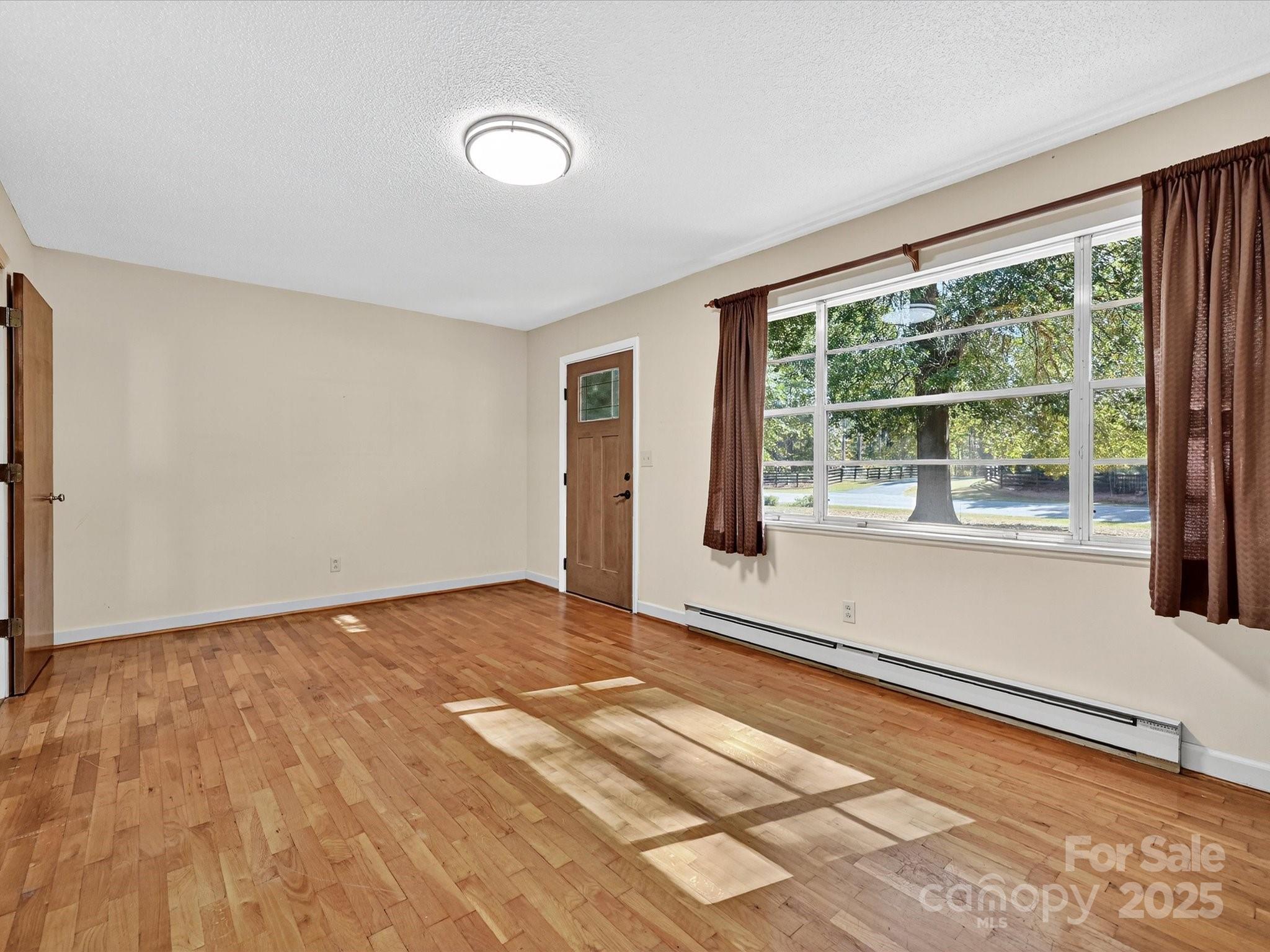341 Camp Creek Road Iron Station, NC 28080 - Photo 11 of 29 a view of an empty room with a window