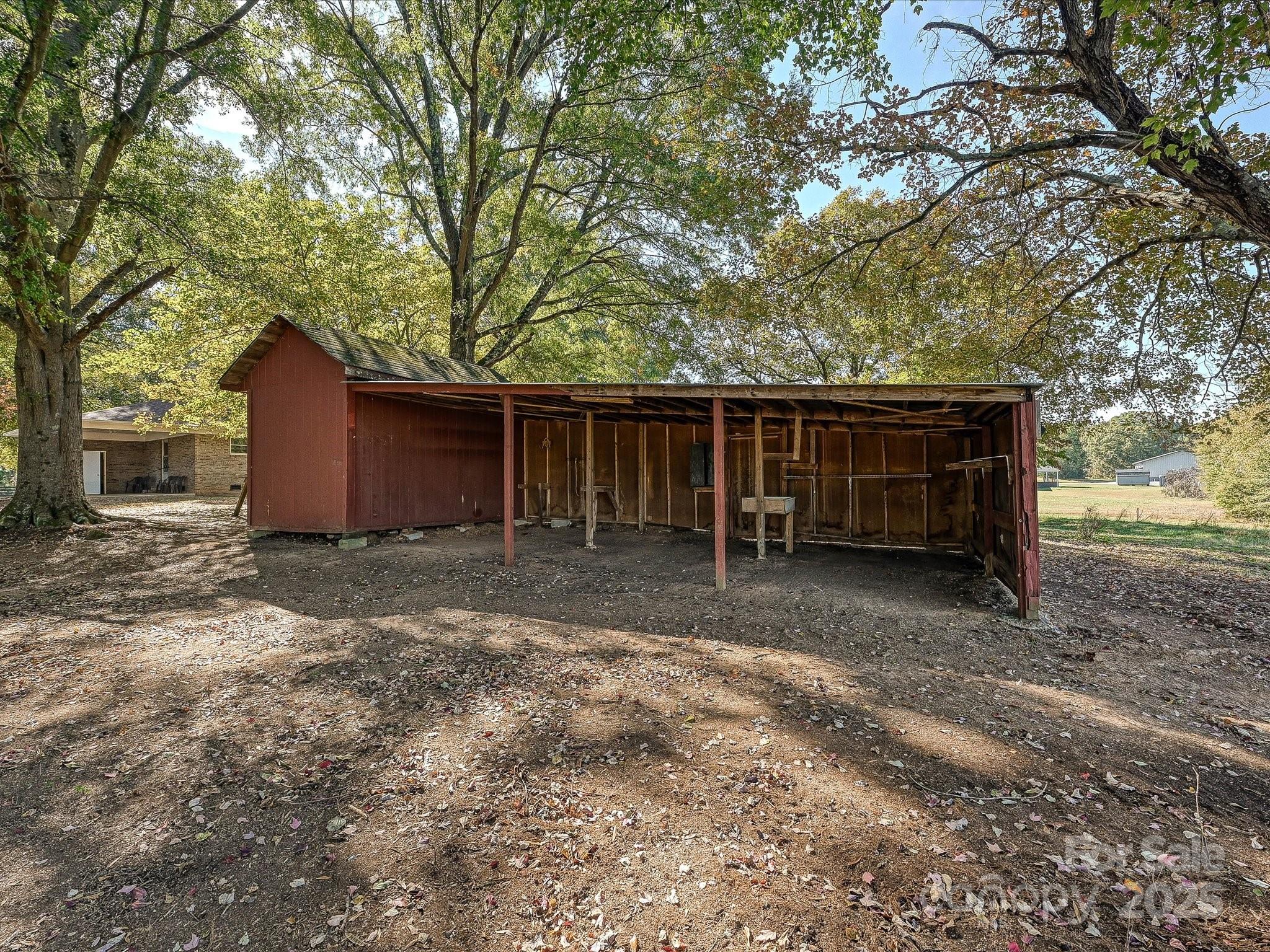 341 Camp Creek Road Iron Station, NC 28080 - Photo 27 of 29 a view of a house with a yard and large tree