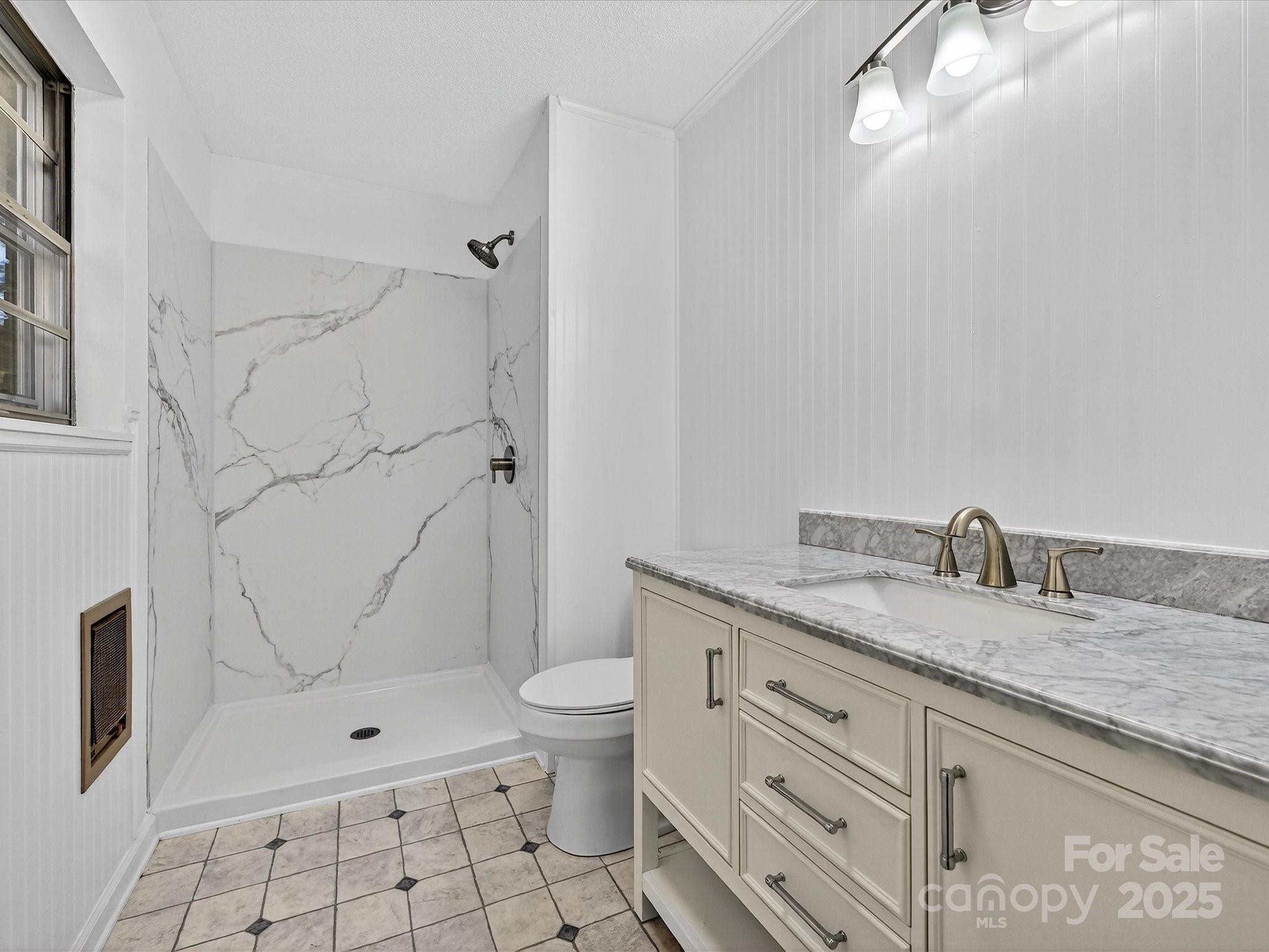 341 Camp Creek Road Iron Station, NC 28080 - Photo 8 of 29 a bathroom with a granite countertop sink a toilet and shower