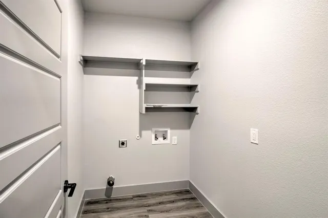 a bedroom with a large bed and a flat screen tv