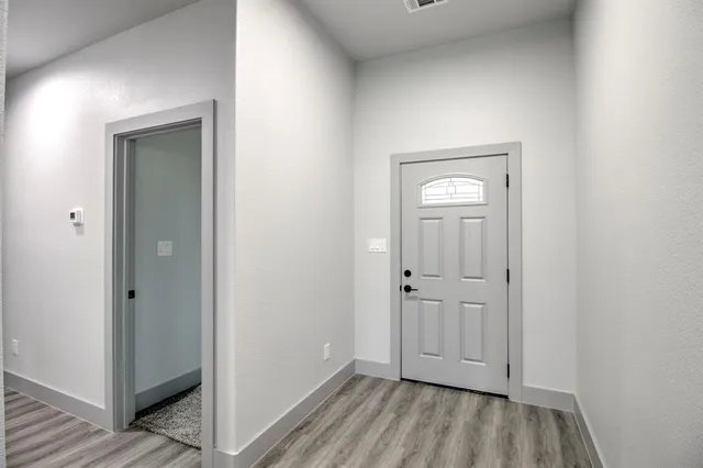 an empty room with closet area