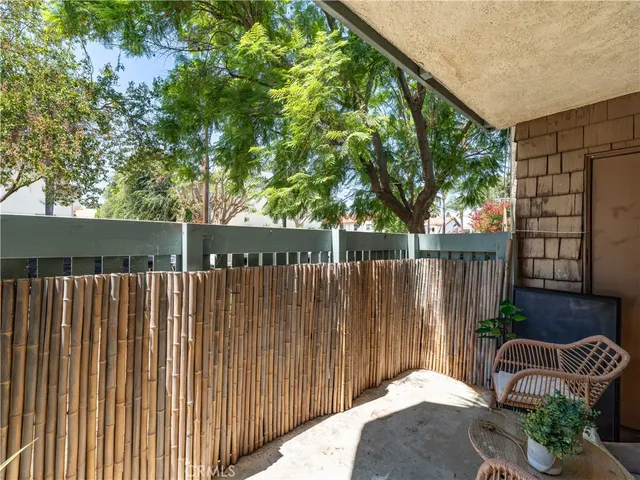 a wooden fence with trees in the background