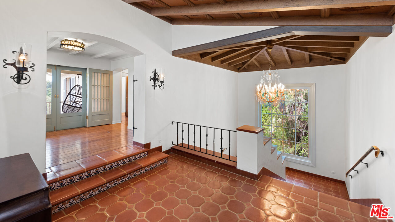 10800 Chalon Road Los Angeles, CA 90077 - Photo 4 of 14 a view of a livingroom with furniture and staircase