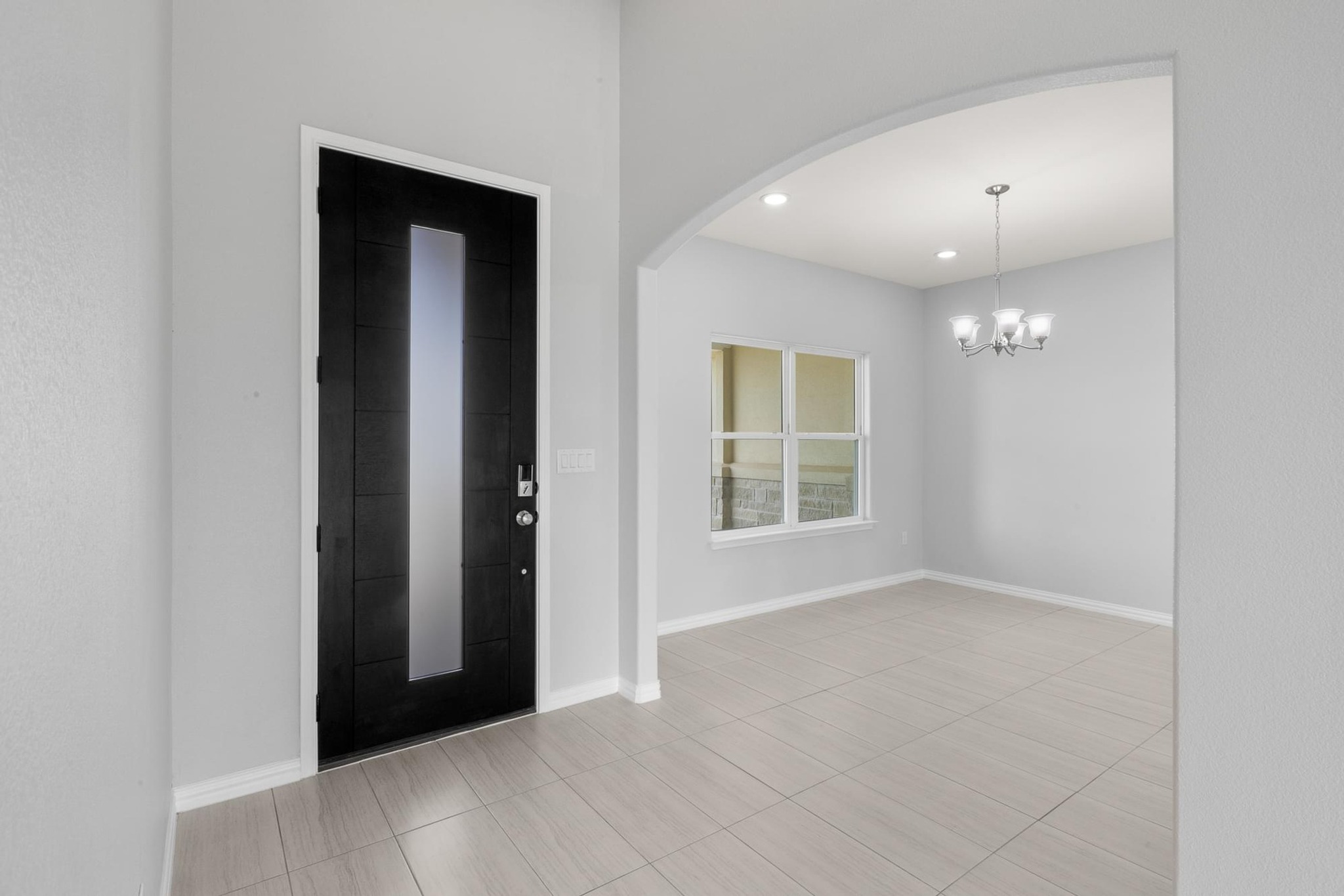 1136 County Road 484 Elgin, TX 78621 - Photo 4 of 37 Entrance foyer with a chandelier, arched walkways, and recessed lighting