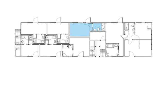 a bedroom with a large bed and a large window