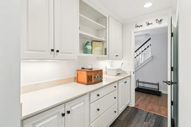 a spacious bathroom with a sink a mirror and a window