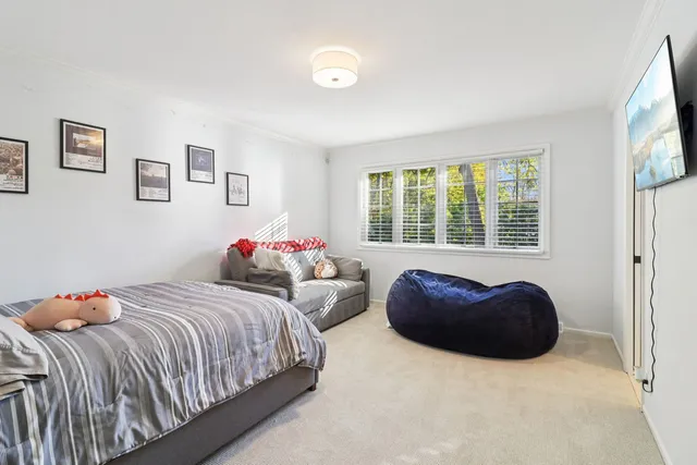 a bedroom with a bed and a cabinets