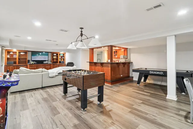 a living room with furniture and flat screen tv