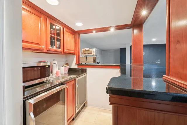 a bathroom with a sink a toilet and vanity