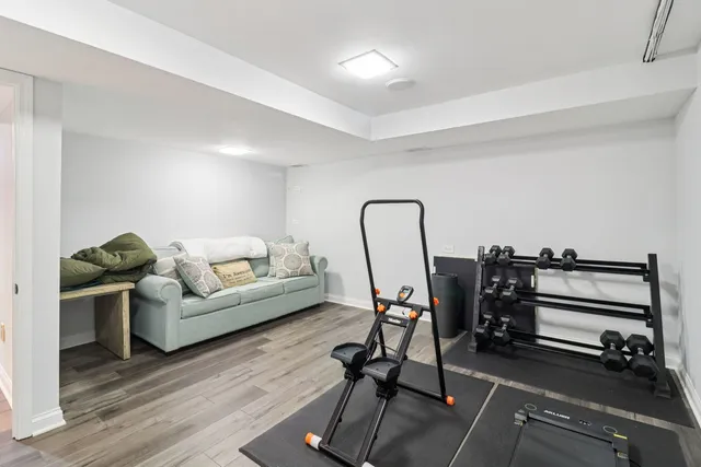 a view of a chair and tables on the wooden floor