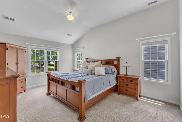 a bed room with a bed and a dresser