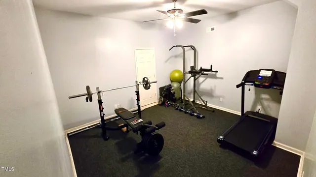 a view of a house with backyard and a tree