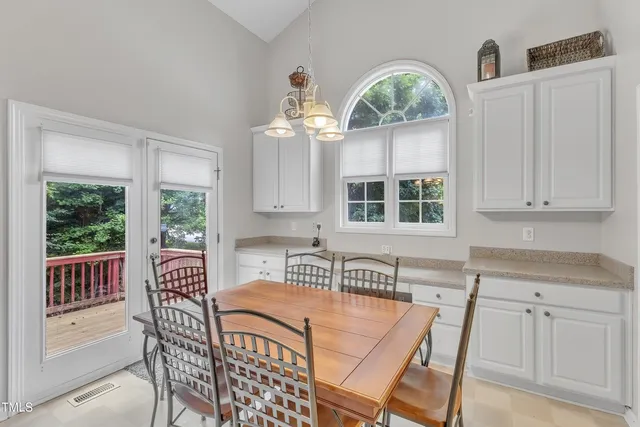 a kitchen with stainless steel appliances granite countertop a sink stove and microwave