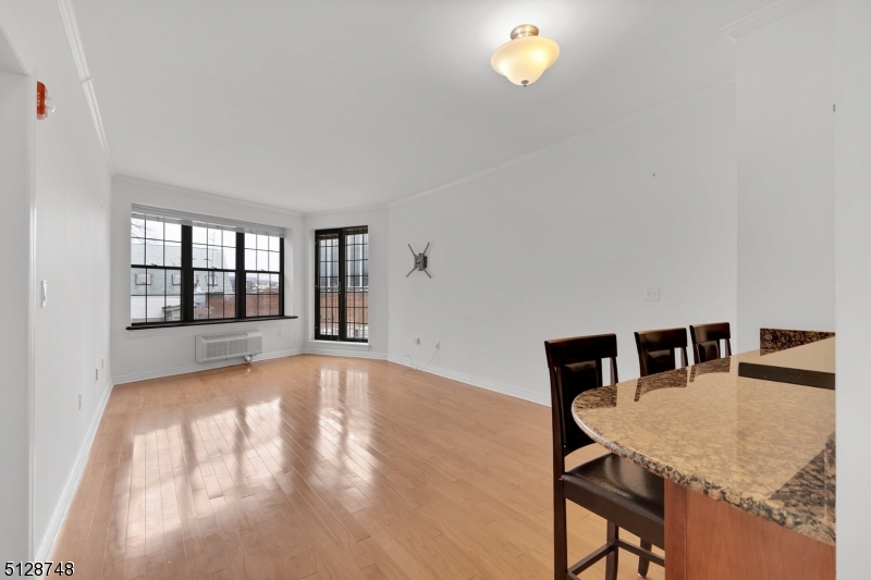 7 Prospect Street, Unit 303 Morristown, NJ 07960 - Photo 14 of 22 a view of kitchen with granite countertop window and dining table
