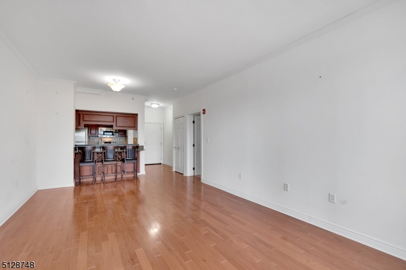 7 Prospect Street, Unit 303 Morristown, NJ 07960 - Photo 16 of 22 a view of empty room with wooden floor