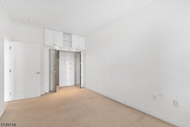 7 Prospect Street, Unit 303 Morristown, NJ 07960 - Photo 18 of 22 a view of a kitchen with white walls