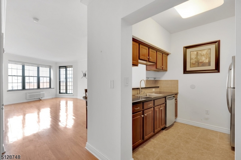 7 Prospect Street, Unit 303 Morristown, NJ 07960 - Photo 7 of 22 a view of a kitchen cabinets and a stove