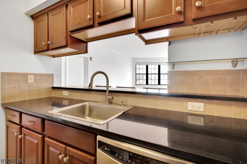 7 Prospect Street, Unit 303 Morristown, NJ 07960 - Photo 8 of 22 a kitchen with a sink and a window
