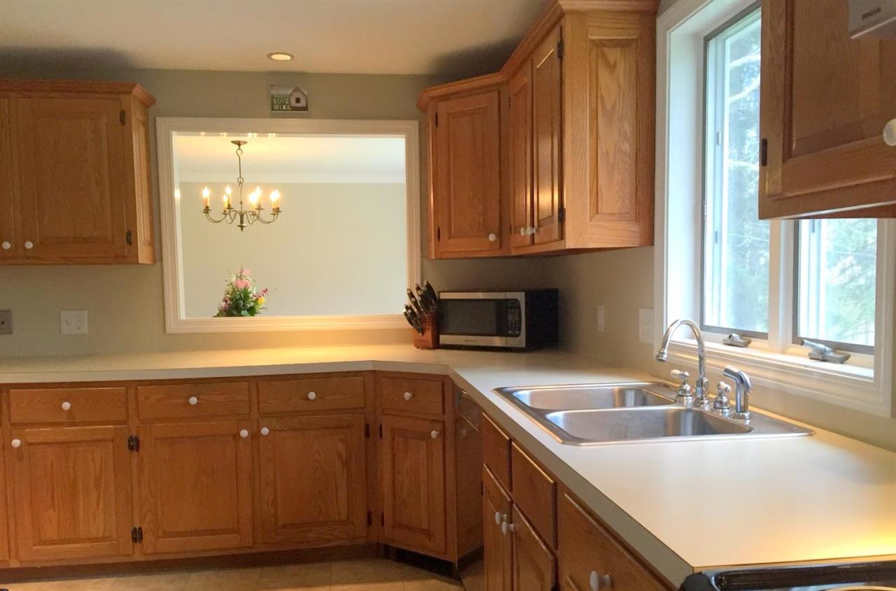 114 County Road Bourne, MA 02532 - Photo 8 of 20 a kitchen with granite countertop a sink and a window