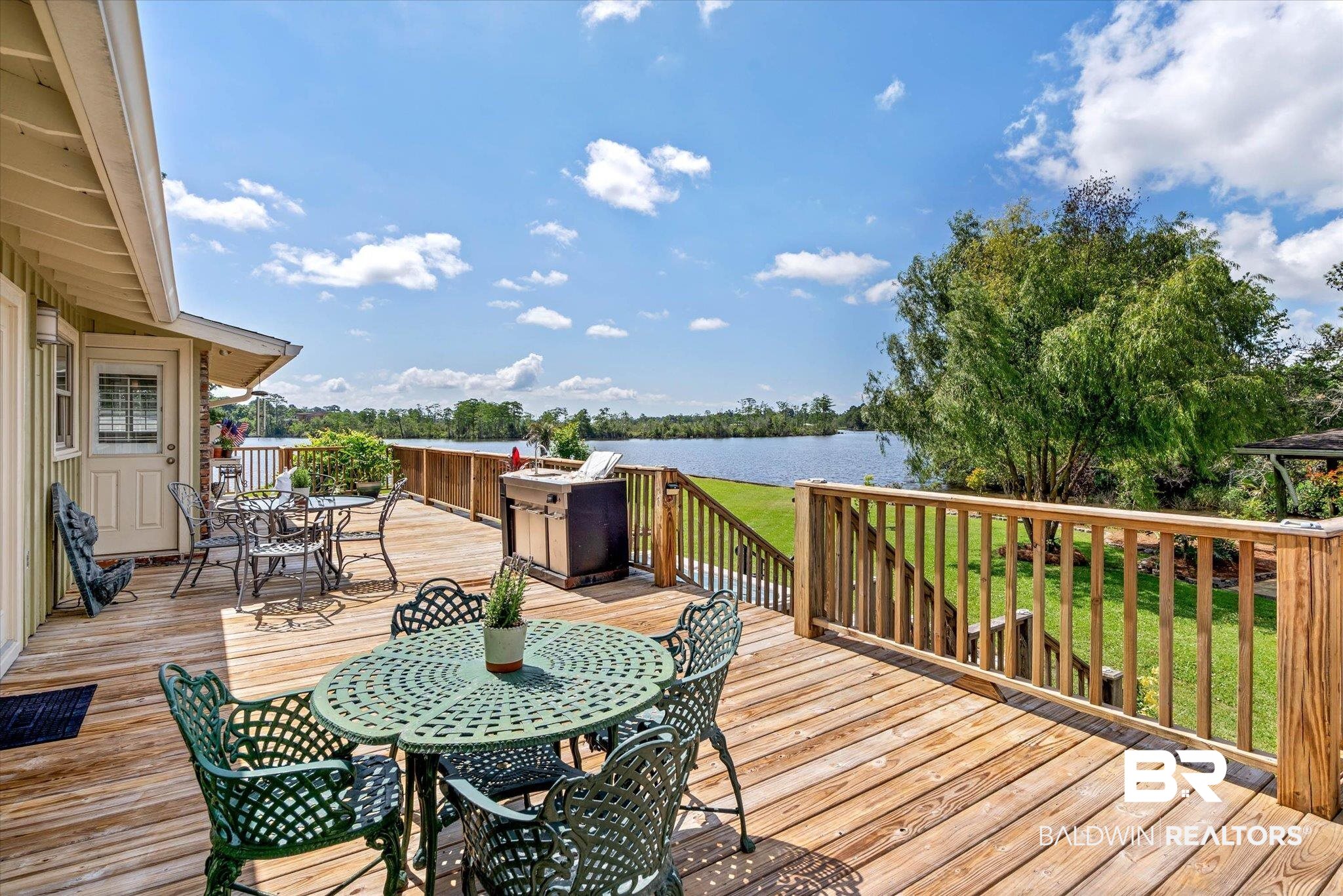 3801 Point Road Mobile, AL 36619 - Photo 29 of 55 Expansive wood deck with a full railing system, offering a broad water frontage