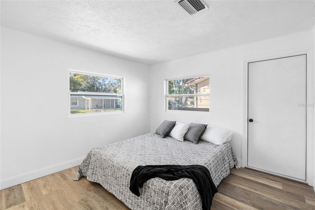 4244 Mesa Drive New Port Richey, FL 34653 - Photo 14 of 35 a bedroom with a bed and a window