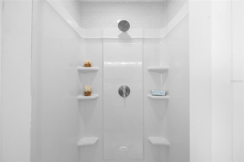 4244 Mesa Drive New Port Richey, FL 34653 - Photo 20 of 35 a bathroom with a shower