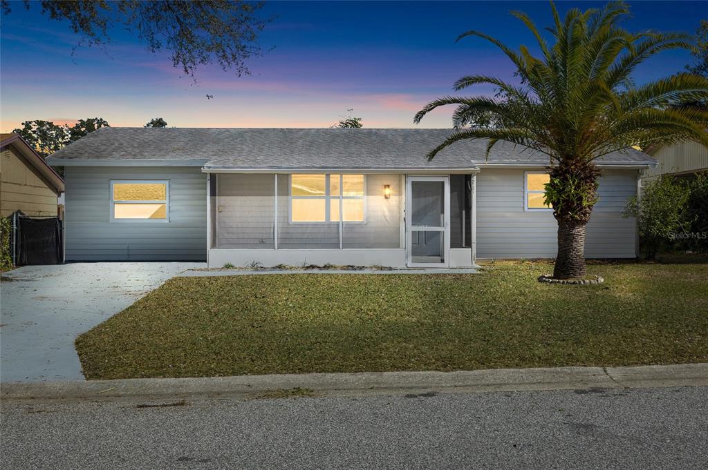 4244 Mesa Drive New Port Richey, FL 34653 - Photo 2 of 35 front view of a house with a yard