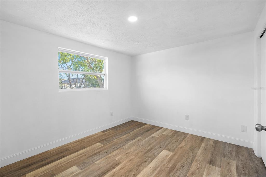 4244 Mesa Drive New Port Richey, FL 34653 - Photo 21 of 35 an empty room with a window