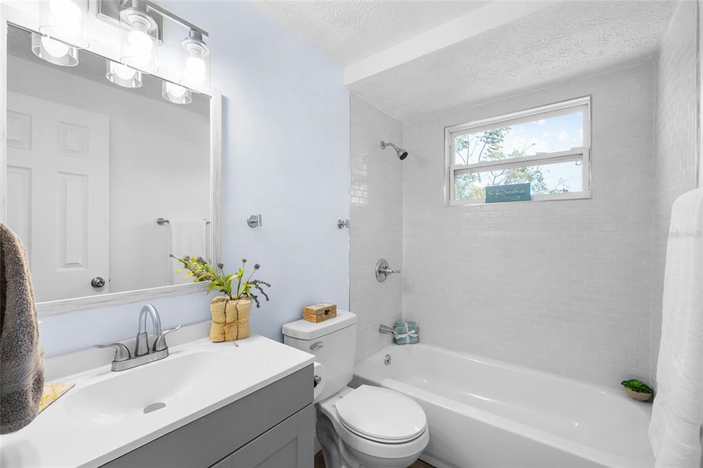4244 Mesa Drive New Port Richey, FL 34653 - Photo 25 of 35 a bathroom with a sink a toilet and bathtub
