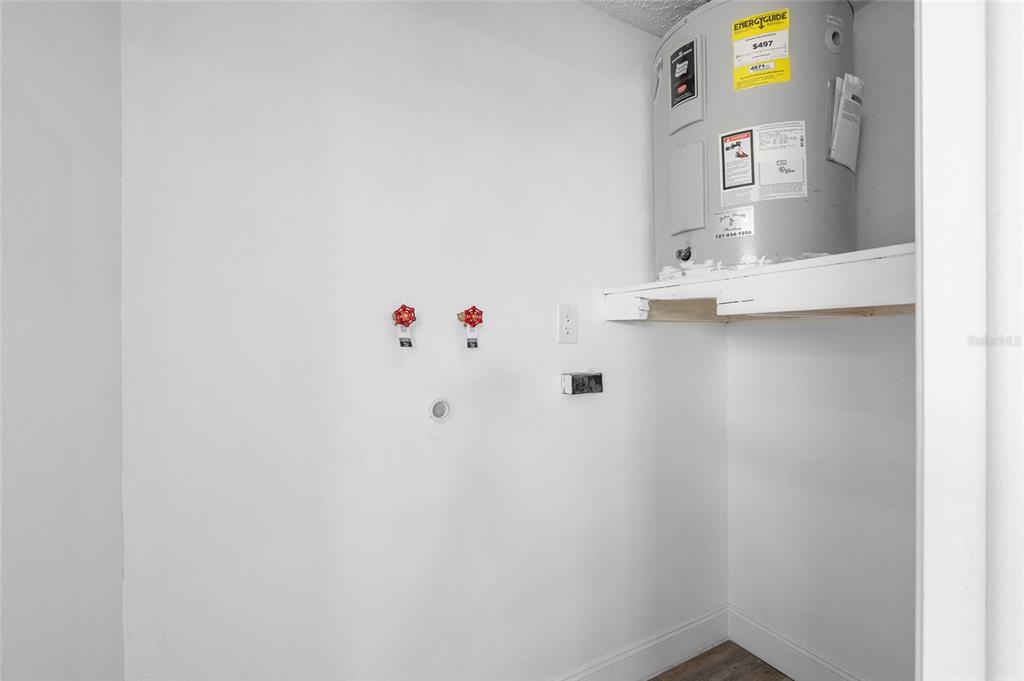 4244 Mesa Drive New Port Richey, FL 34653 - Photo 26 of 35 a utility room with dryer and washer