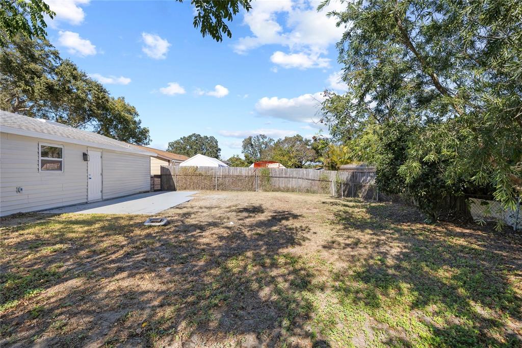 4244 Mesa Drive New Port Richey, FL 34653 - Photo 29 of 35 a view of a back yard of the house