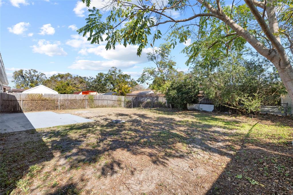 4244 Mesa Drive New Port Richey, FL 34653 - Photo 30 of 35 a view of a yard with an outdoor space