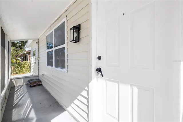 a bathroom with a bathtub and a window